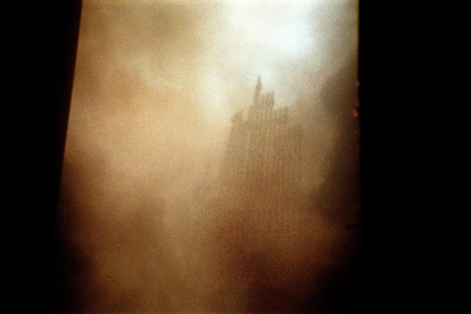 The Twin Towers rubble seen through the dust.