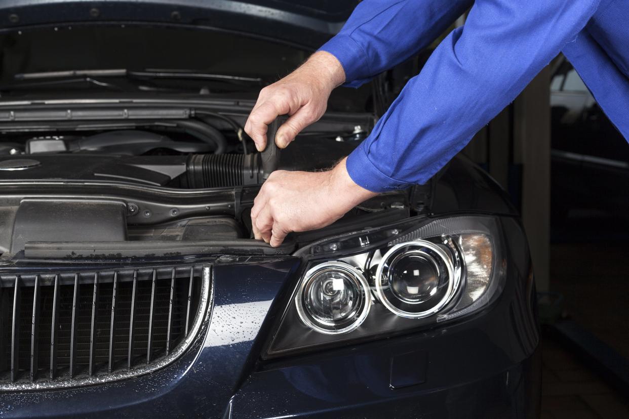 mechanic hands on BMW