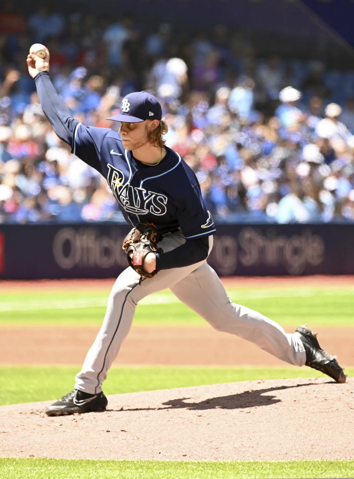 Tampa Bay Rays starting pitcher Shane Baz throws to a Toronto Blue Jays batter in the first inning of a baseball game in Toronto, Sunday, July 3, 2022. (Jon Blacker/The Canadian Press via AP)