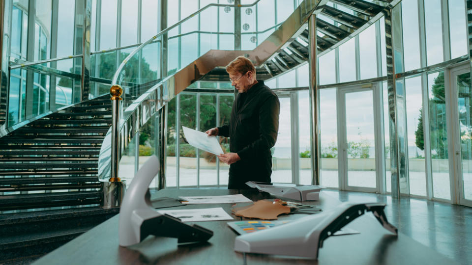 Mika Häkkinen, two-time Formula 1 World Champion, looking at designs for the all-electric Mika Häkkinen Signature Edition bike from Verge Motorcycles.