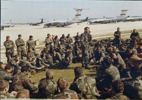 Capt. Ben Morris, commander of Company C, 2nd Battalion, 505th Parachute Infantry Regiment, briefs paratroopers on Pope Airfield on Oct. 24, 1983, before they loaded onto aircraft bound for the island nation of Grenada.