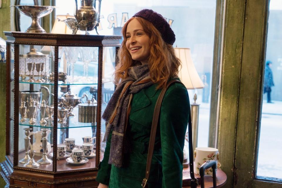 Ashleigh Cummings standing in an antique store in The Goldfinch