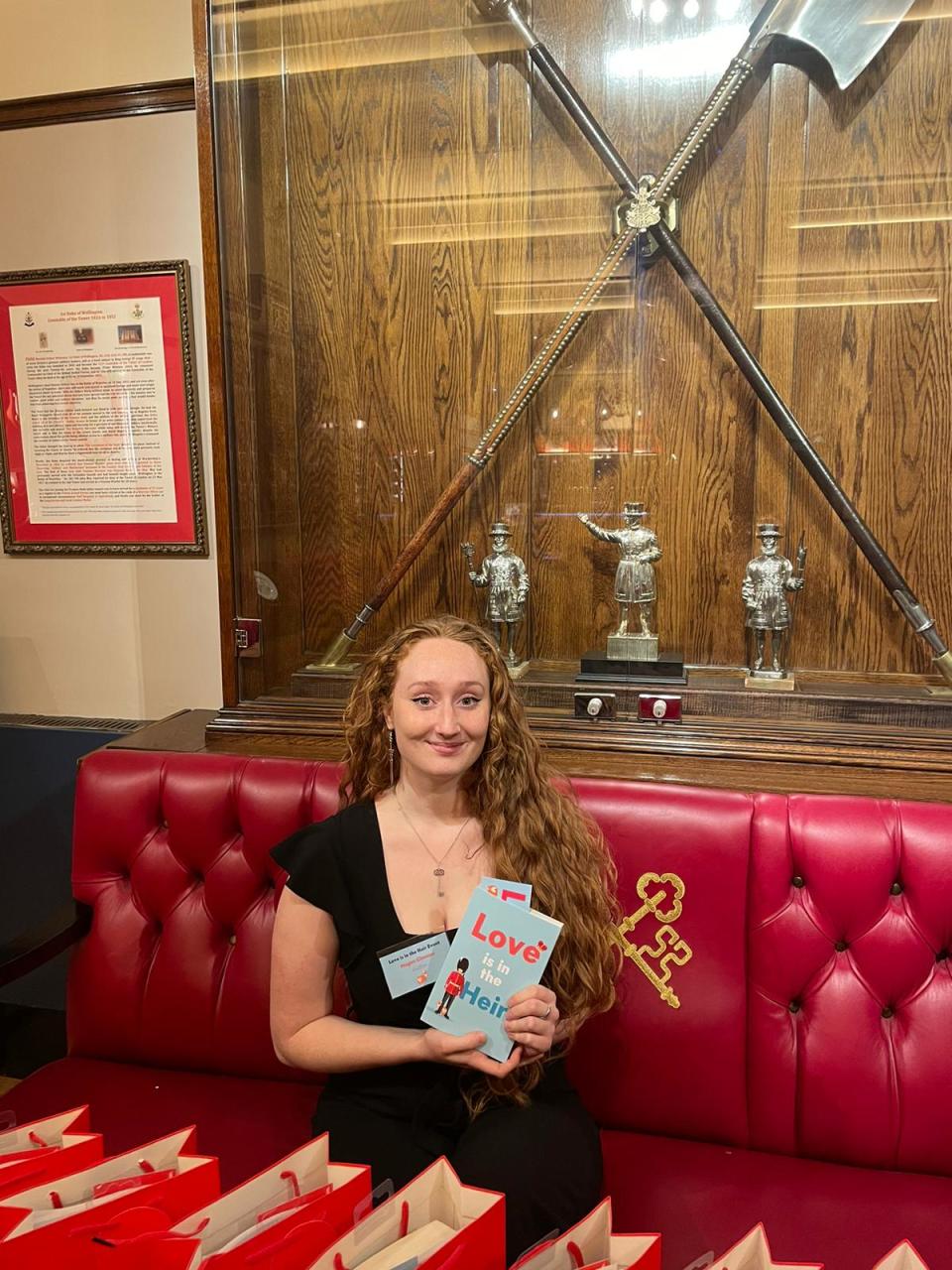 Megan holding up a copy of her debut novel. (Megan Clawson / Courtesy of Megan Clawson)