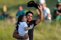 Aug 16, 2015; Sheboygan, WI, USA; Jason Day walks off the 18th green with his son Dash Day after winning the 2015 PGA Championship golf tournament at Whistling Straits. Mandatory Credit: Thomas J. Russo-USA TODAY Sports