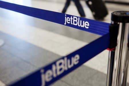 A JetBlue Airways logo is seen at the check-in counter at LaGuardia Airport in New York April 5, 2012. REUTERS/Lucas Jackson