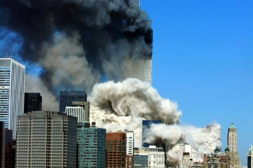 Black smoke billows from the World Trace Center after the first tower collapsed on September 11, 2001