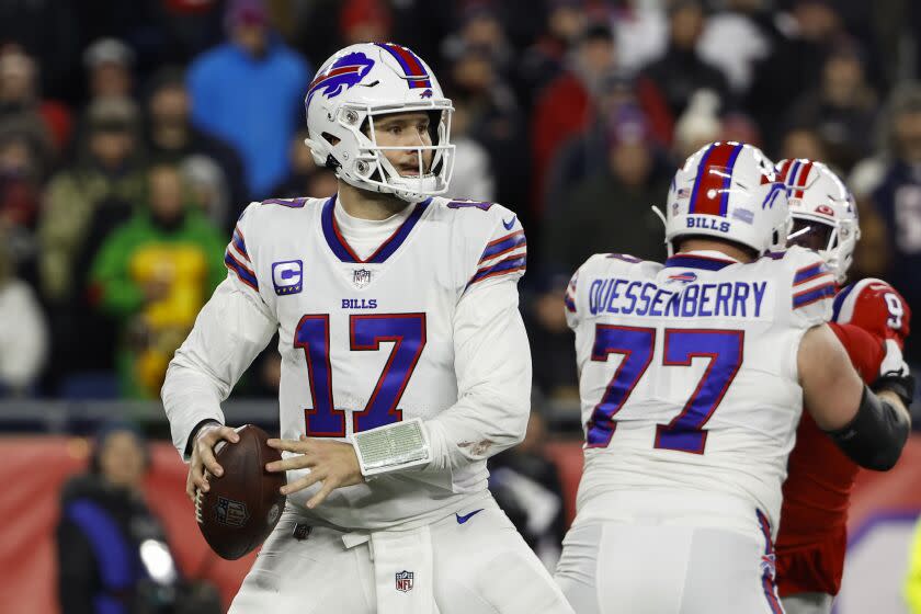 Buffalo Bills quarterback Josh Allen looks to pass against the New England Patriots during an NFL football game at Gillette Stadium, Thursday, Dec. 1, 2022 in Foxboro, Mass. (Winslow Townson/AP Images for Panini)