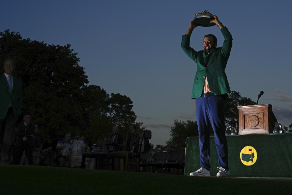 Scottie Scheffler holds the trophy after winning the Masters golf tournament at Augusta National Golf Club Sunday, April 14, 2024, in Augusta, Ga. (AP Photo/Matt Slocum)