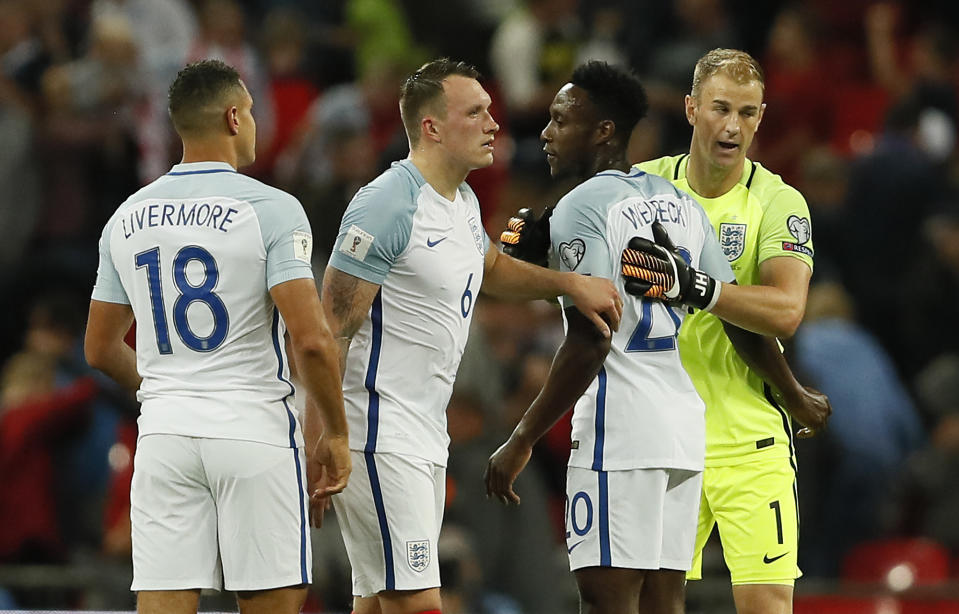 <p>England’s goalkeeper Joe Hart, Danny Welbeck, Phil Jones and Jake Livermore, from right, embrace after winning the World Cup Group F qualifying soccer match between England and Slovakia at Wembley Stadium in London, England, Monday, Sept. 4, 2017. (AP Photo/Kirsty Wigglesworth) </p>