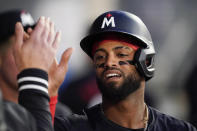 Minnesota Twins' Willi Castro is congratulated after scoring against the Los Angeles Angels during the third inning of a baseball game Saturday, April 27, 2024, in Anaheim, Calif. (AP Photo/Ryan Sun)