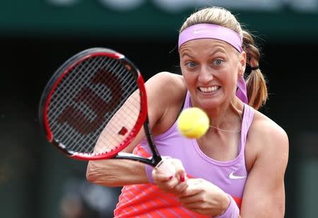 Petra Kvitova of the Czech Republic plays a shot to Irina-Camelia Begu of Romania during their women's singles match at the French Open tennis tournament at the Roland Garros stadium in Paris, France, May 30, 2015. REUTERS/Pascal Rossignol