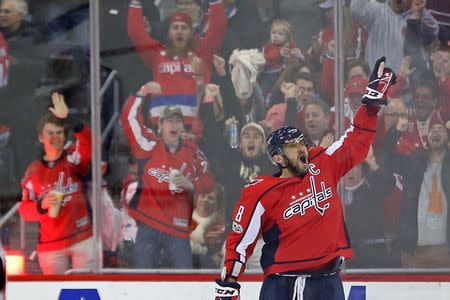 Dec 16, 2017; Washington, DC, USA; Washington Capitals left wing Alex Ovechkin (8) celebrates after scoring the game-winning goal in overtime against the Anaheim Ducks at Capital One Arena. The Capitals won 3-2 in overtime. Mandatory Credit: Geoff Burke-USA TODAY Sports