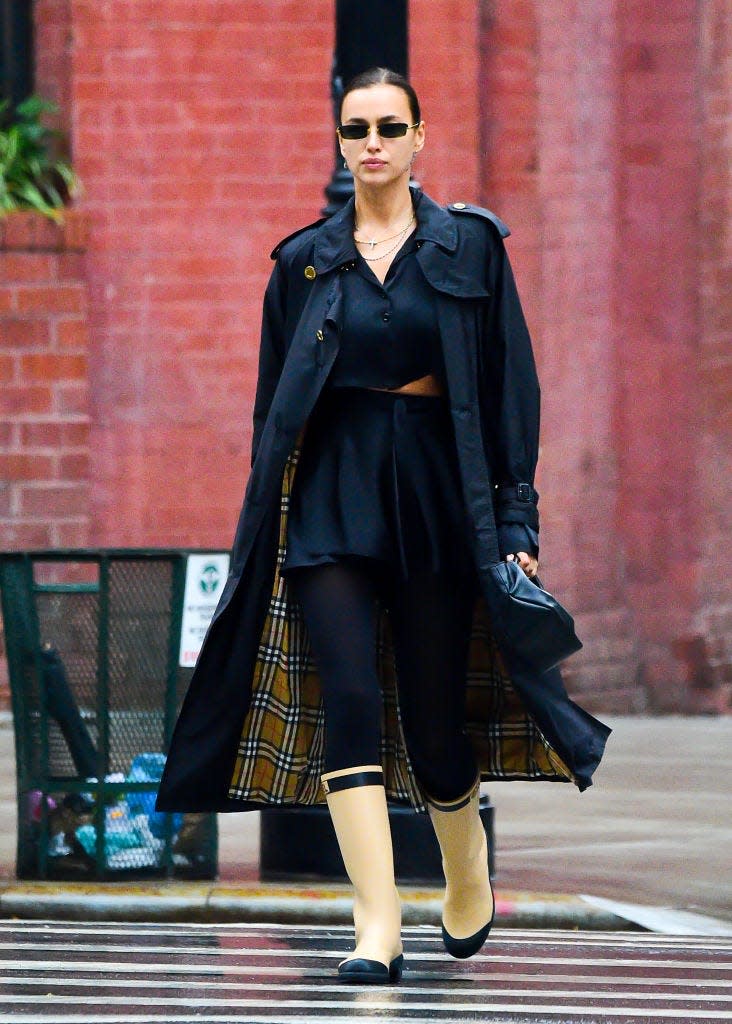 <p>Once again <a href="https://www.elle.com/uk/fashion/a28080681/irina-shayk-lea-de-seine-shayk-cooper-matching-burberry/" rel="nofollow noopener" target="_blank" data-ylk="slk:twinning in Burberry with her daughter;elm:context_link;itc:0;sec:content-canvas" class="link ">twinning in Burberry with her daughter</a>, Irina Shayk stepped out for the school run in an epic designer ensemble.</p><p>The 34 year-old paired her Burberry trench coat with a pair of <a href="https://www.elle.com/uk/fashion/trends/a34367206/welly-boot-trend/" rel="nofollow noopener" target="_blank" data-ylk="slk:Chanel Wellington boots;elm:context_link;itc:0;sec:content-canvas" class="link ">Chanel Wellington boots</a>.</p><p>Finishing of the rain-ready look the mum wore a <a href="https://www.net-a-porter.com/en-gb/shop/designer/orseund-iris" rel="nofollow noopener" target="_blank" data-ylk="slk:Orseund Iris;elm:context_link;itc:0;sec:content-canvas" class="link ">Orseund Iris</a> two-piece that fellow model <a href="https://www.elle.com/uk/fashion/celebrity-style/g34517348/emily-ratajkowski-pregnancy-style/?slide=9" rel="nofollow noopener" target="_blank" data-ylk="slk:Emily Ratajkowski owns in ivory;elm:context_link;itc:0;sec:content-canvas" class="link ">Emily Ratajkowski owns in ivory</a>, with a Demellier Los Angeles bag.</p><p><a class="link " href="https://uk.burberry.com/the-westminster-heritage-trench-coat-p80280931" rel="nofollow noopener" target="_blank" data-ylk="slk:SHOP IRINA'S BURBERRY TRENCH NOW;elm:context_link;itc:0;sec:content-canvas">SHOP IRINA'S BURBERRY TRENCH NOW</a></p>