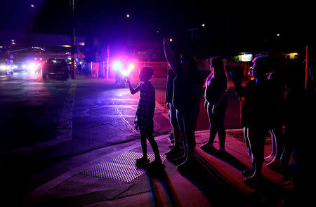 Onlookers show support as demonstrators march during a rally against President-elect Donald Trump in the Barrio Logan area of in San Diego, California U.S. November 11, 2016. REUTERS/Sandy Huffaker