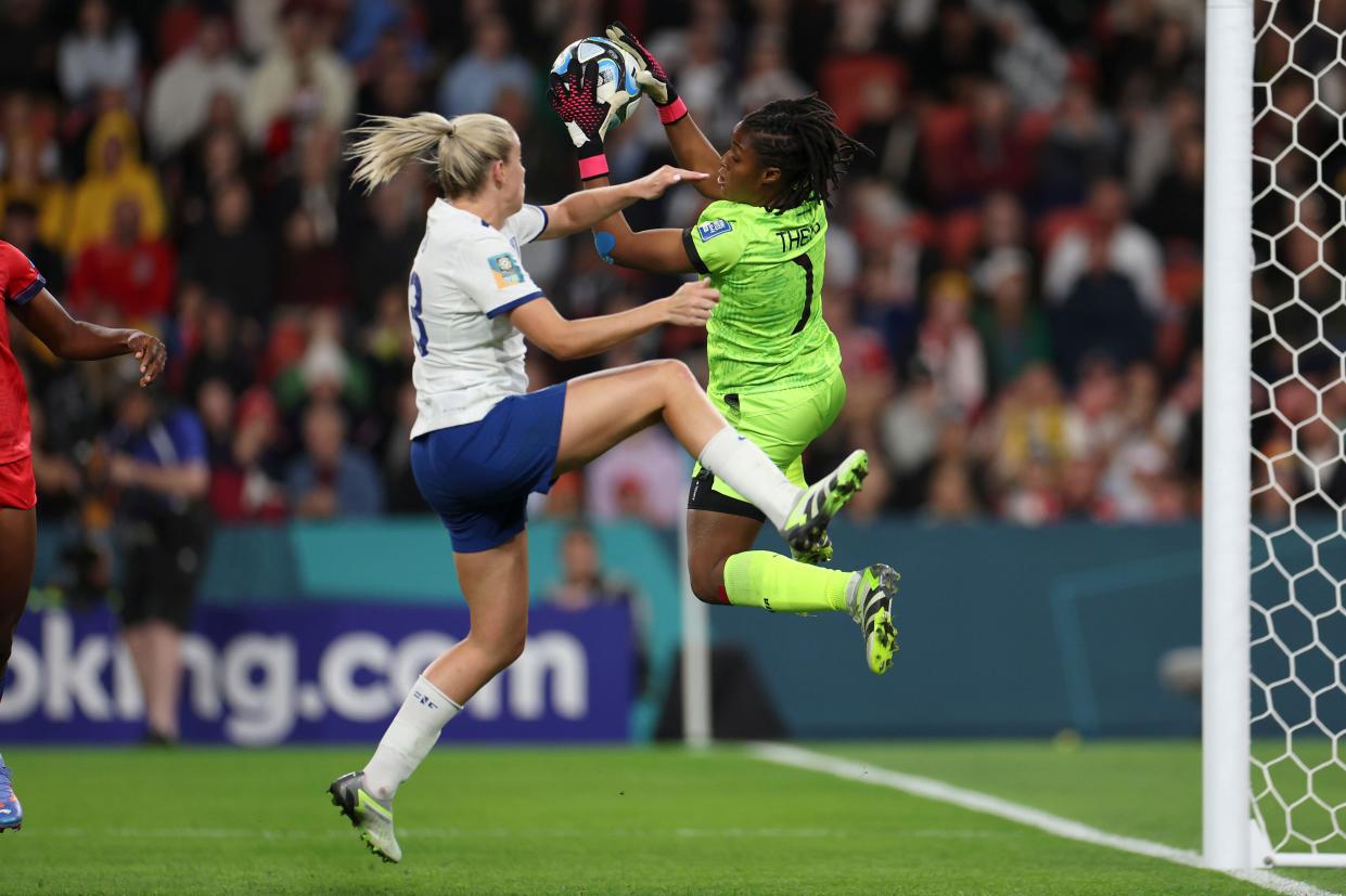 England's Alessia Russo competes for the ball with Haiti's goalkeeper Kerly Theus during the Women's World Cup Group D soccer match between England and Haiti in Brisbane, Australia, Saturday, July 22, 2023. (AP Photo/Katie Tucker)