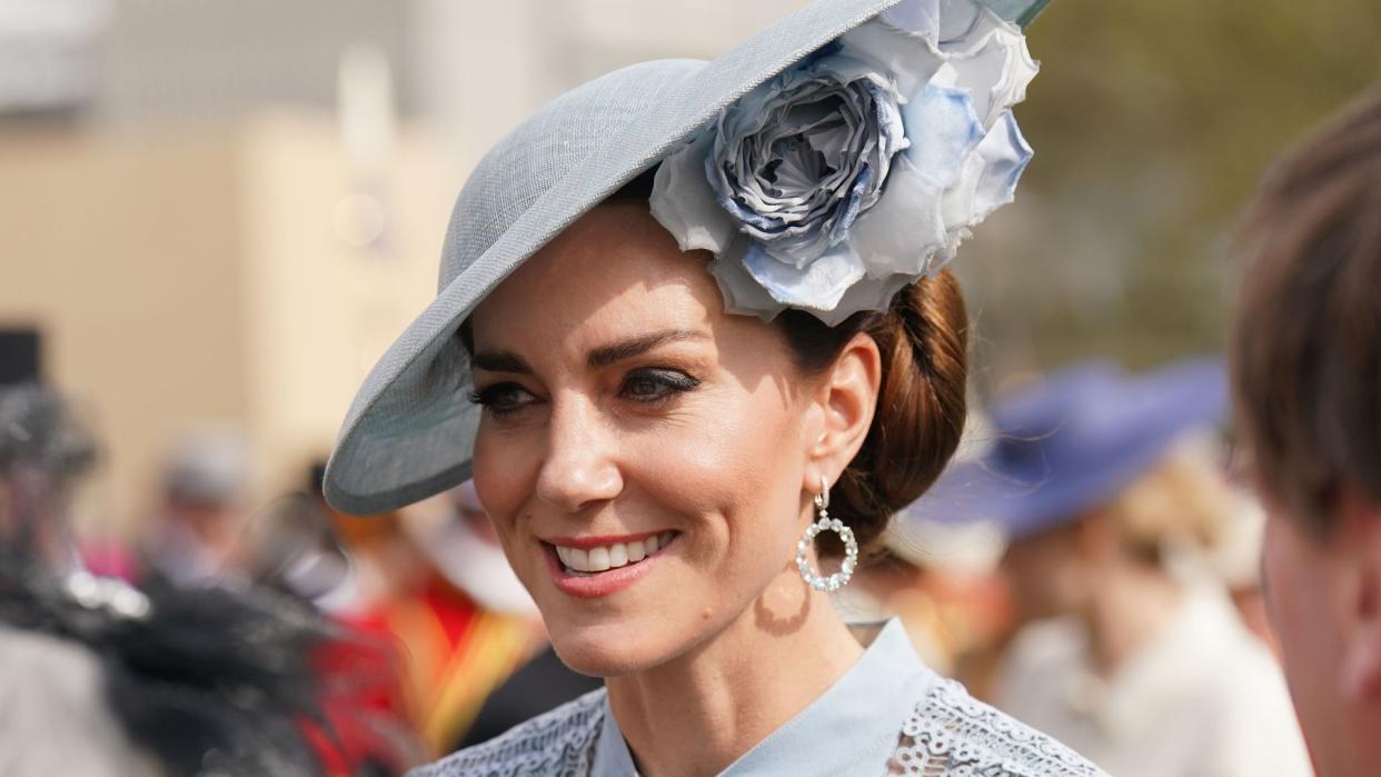 Kate Middleton wearing blue dress and hat at garden party