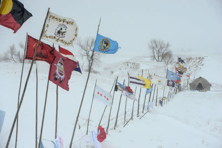 The Oceti Sakowin camp is seen in a snow storm during a protest against plans to pass the Dakota Access pipeline near the Standing Rock Indian Reservation, near Cannon Ball, North Dakota, U.S. November 29, 2016. REUTERS/Stephanie Keith