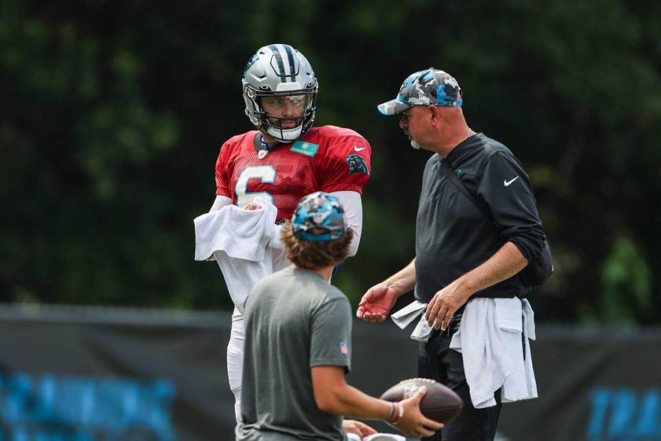 Panthers quarterback Baker Mayfield, left, gets some coaching during training camp at Wofford College on Tuesday, August 9, 2022 in Spartanburg, SC.