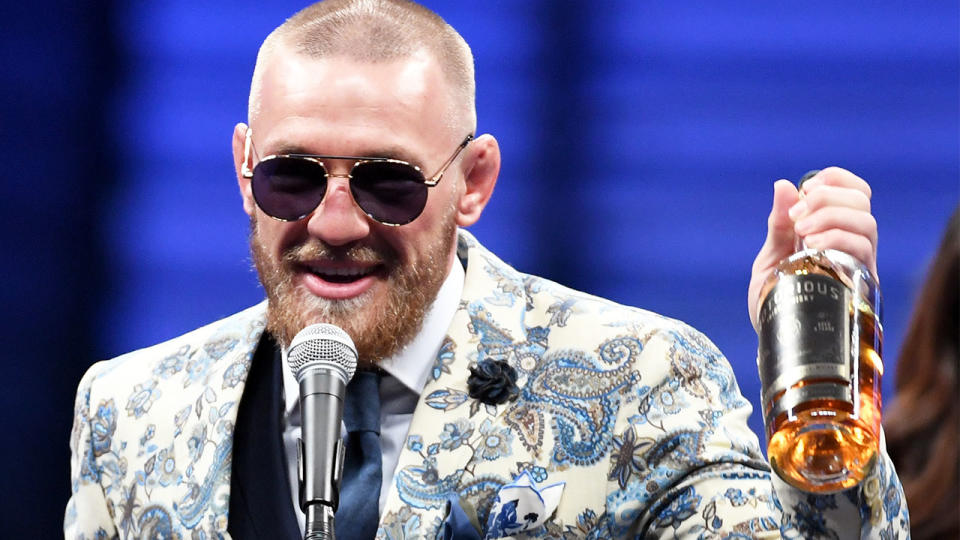 Conor McGregor (pictured) holding up his Proper No. Twelve Irish whiskey.