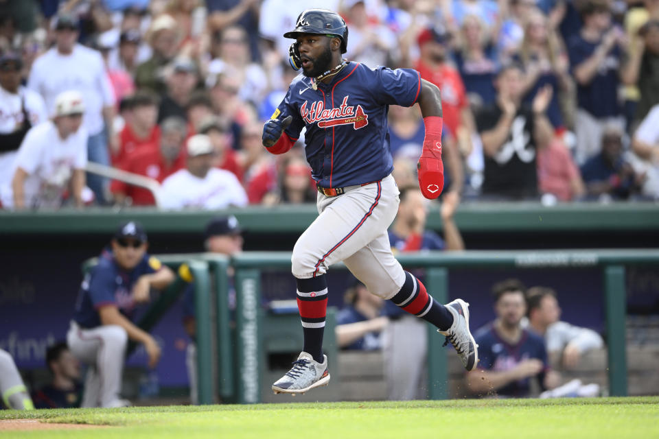 Atlanta Braves' Michael Harris II runs towards home to score on a double by Ozzie Albies during the fifth inning of a baseball game against the Washington Nationals, Saturday, June 8, 2024, in Washington. (AP Photo/Nick Wass)