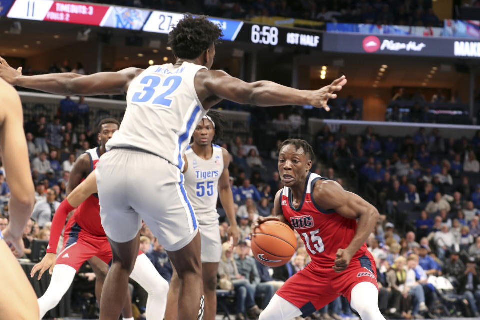 Memphis James Wiseman (32) guards Illinois-Chicago Godwin Boahen (25) during the first half of an NCAA college basketball game Friday, Nov. 8, 2019, in Memphis, Tenn. (AP Photo/Karen Pulfer Focht)