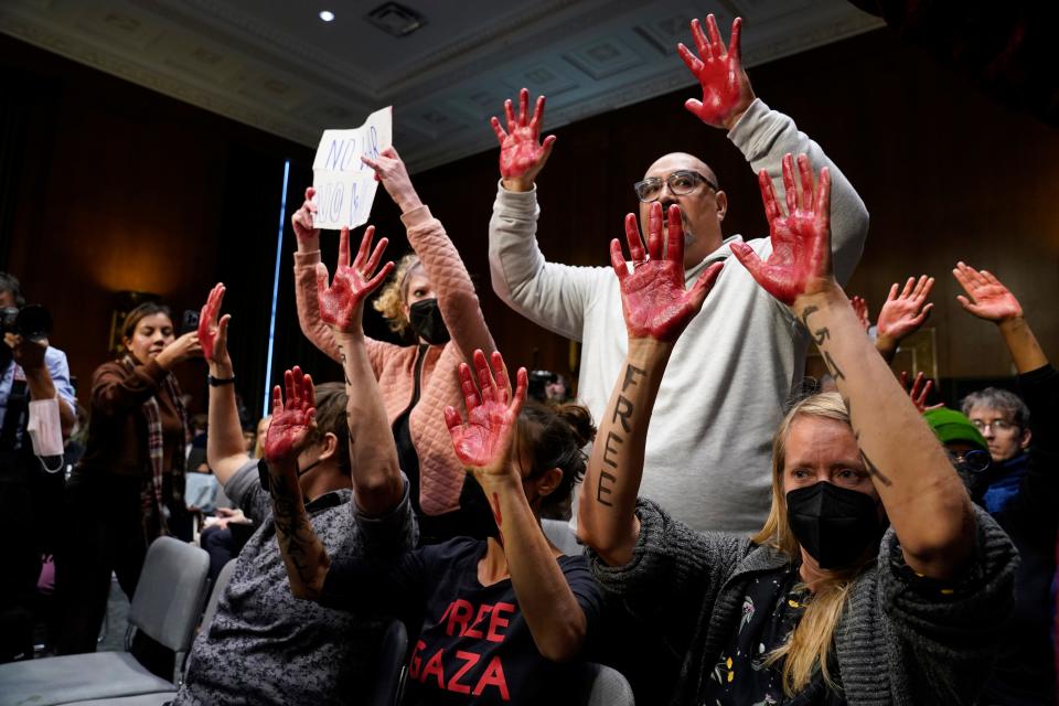 Protesters interupt a hearing as Secretary of State Antony Blinken and Defense Secretary Lloyd Austin testify before the Senate Appropriations Committee on Tuesday, Oct. 31, 2023 in Washington, D.C.