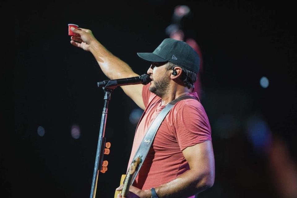 Luke Bryan toasts the crowd with a shot of tequila.