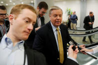 U.S. Senator Lindsey Graham (R-SC) talks to reporters as he arrives ahead of a vote on a bill to renew the National Security Agency’s warrantless internet surveillance program, at the U.S. Capitol in Washington, U.S. January 18, 2018. REUTERS/Jonathan Ernst