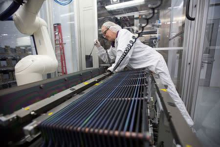 Production operator, Kathy Grady is seen at work at the SolarWorld solar panel factory in Hillsboro, Oregon, U.S., January 15, 2018. Picture taken January 15, 2018. REUTERS/Natalie Behring