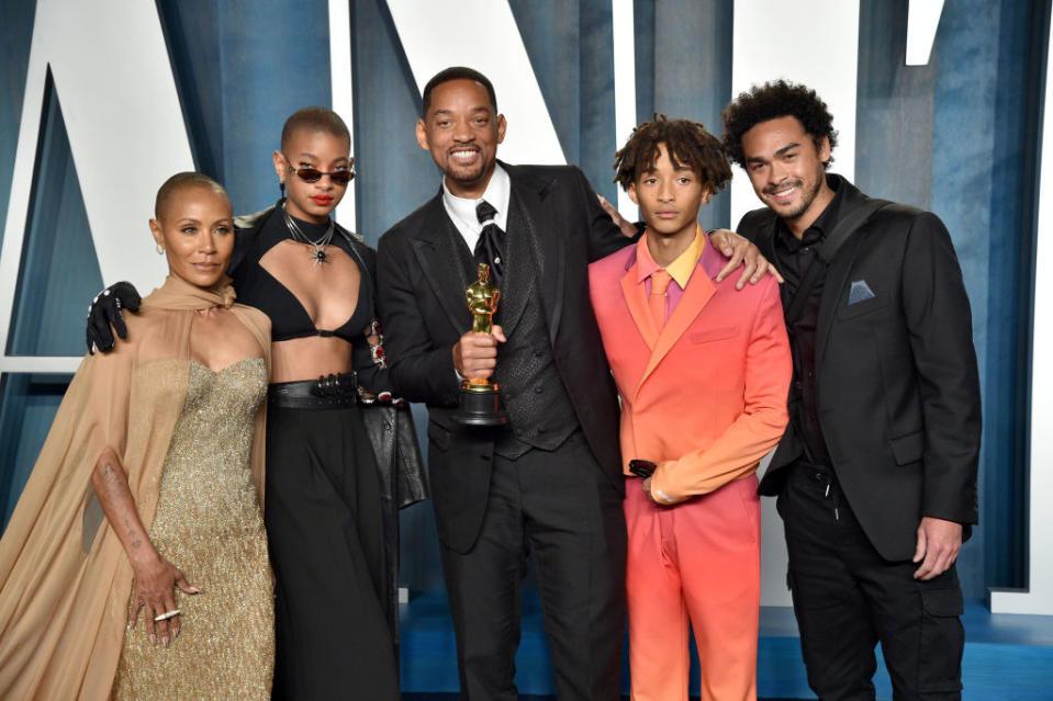 A closeup of the family at the Oscars with Will holding his award