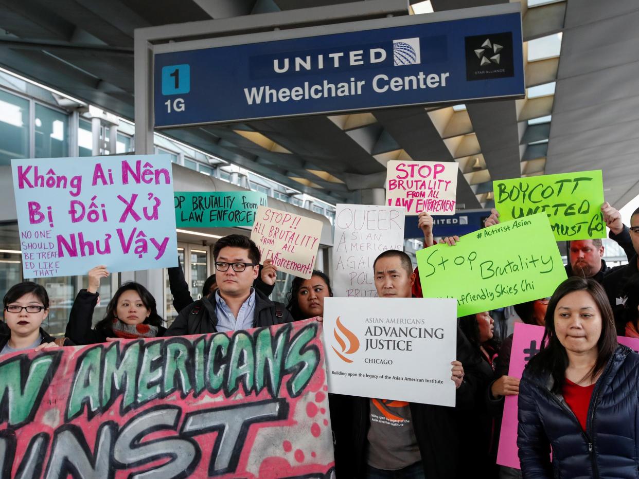 Protesters at O'Hare International Airport in Chicago, where doctor David Dao was forcibly removed from a United Airlines flight: Reuters