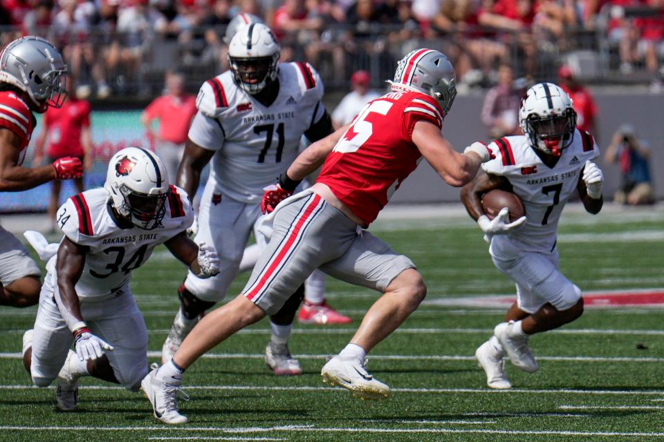 September 10, 2022; Columbus, Ohio, USA; Ohio State Buckeyes linebacker Tommy Eichenberg (35) moves to intercept Arkansas State Red Wolves wide receiver Champ Flemings (7) at Ohio Stadium. Mandatory Credit: Joseph Scheller-The Columbus Dispatch