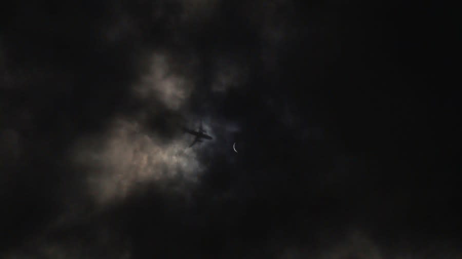 The shadow of a plane passes by a near-total solar eclipse in Hutto, Texas, on April 8, 2024. (Courtesy Michael Franks)