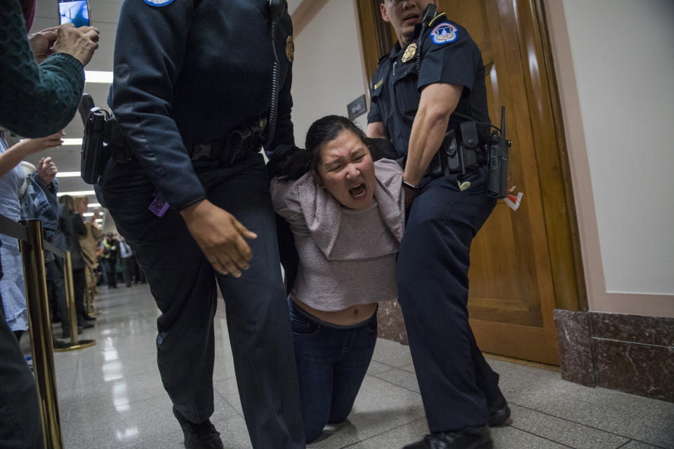 <p>Protesters disrupt the Senate Budget Committee markup of the tax reform bill in Dirksen Building on Nov. 28, 2017. (Photo: Tom Williams/CQ Roll Call/Getty Images) </p>