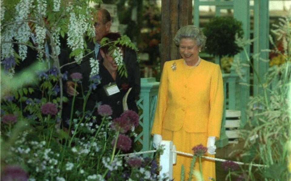 The Queen looks around exhibits at the Chelsea Flower Show in 1994 - PA