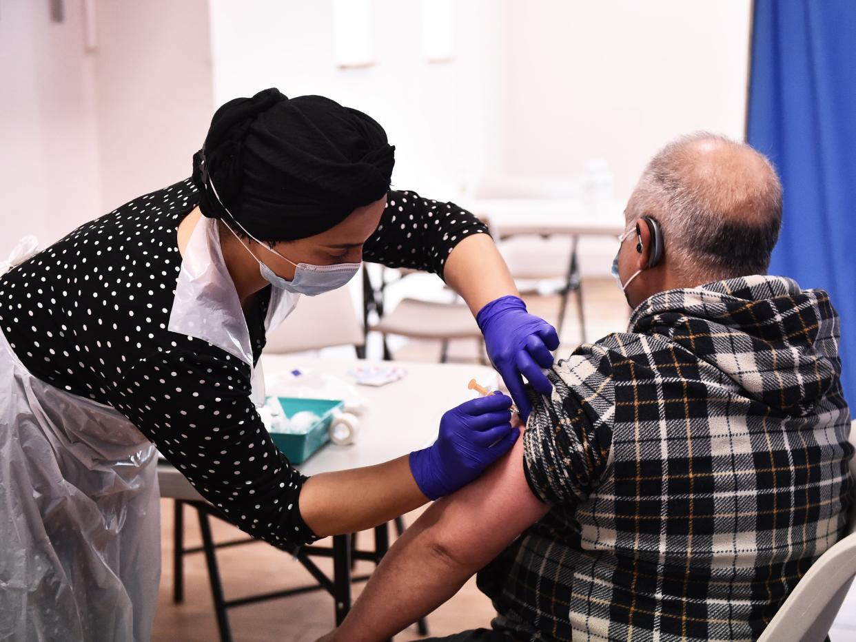 A person receives the AstraZeneca vaccine in Derby, England (Getty Images)