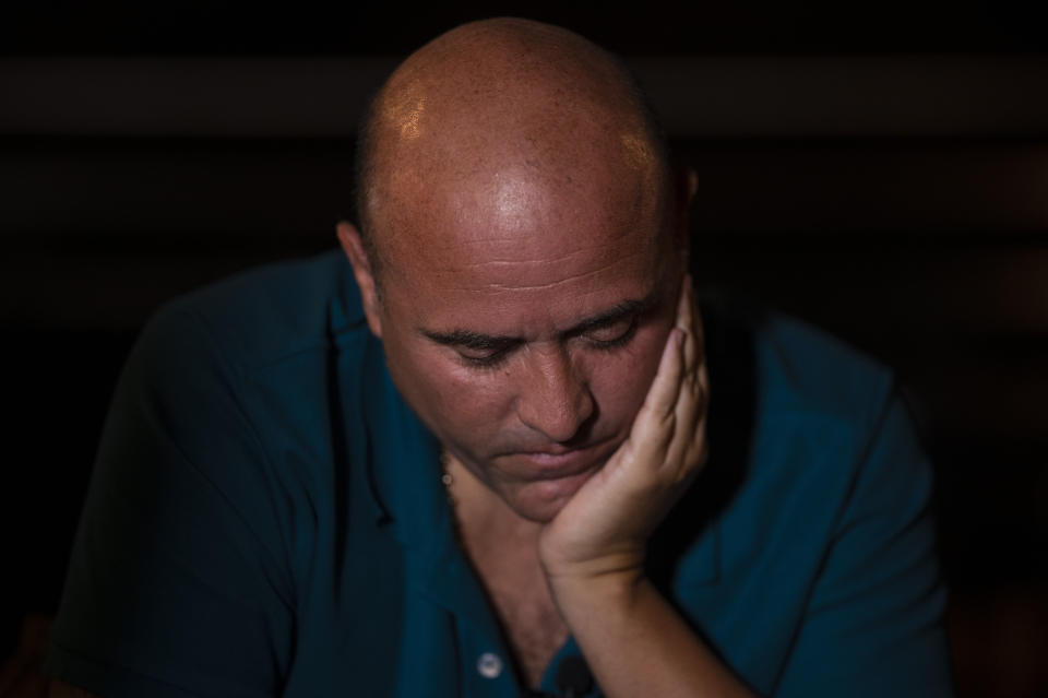 Jose Irizarry, a once-standout DEA agent sentenced to more than 12 years in federal prison for conspiring to launder money with a Colombian cartel, pauses during an interview the night before going to a federal detention center, in San Juan, Puerto Rico, Wednesday, Jan. 5, 2022. He was betrayed by one of his closest confidants, a Venezuelan-American informant who confessed to diverting funds from the undercover stings and making cash payments to his longtime handler. (AP Photo/Carlos Giusti)