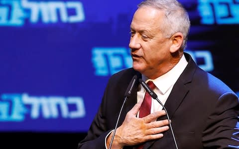 Blue and White party leader Benny Gantz speaks at the party's headquarters following the announcement of exit polls during Israel's parliamentary election in Tel Aviv - Credit: Reuters