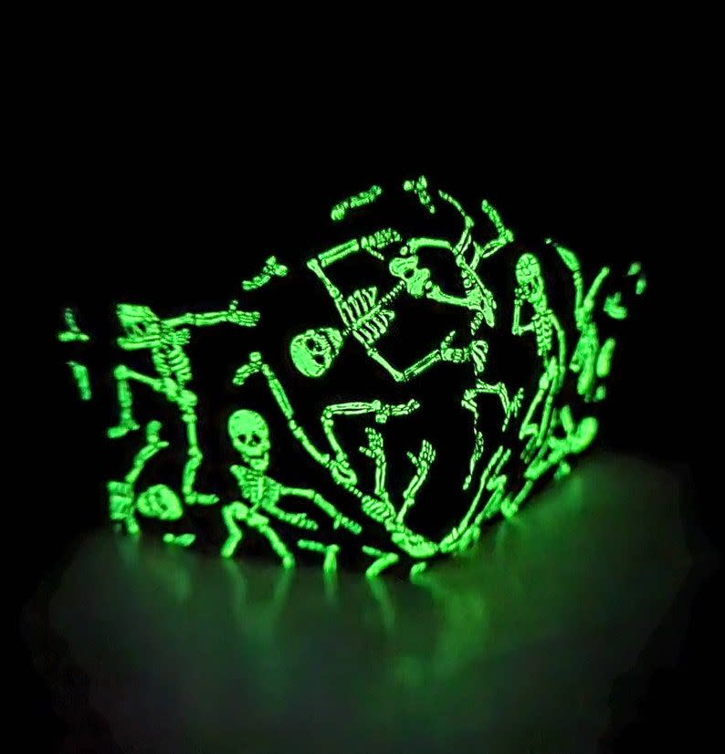 <p><strong>UpInASwing</strong></p><p>etsy.com</p><p><strong>$12.00</strong></p><p>Need we say more than “glow-in-the-dark skeletons on a face mask”? We didn’t think so.</p>