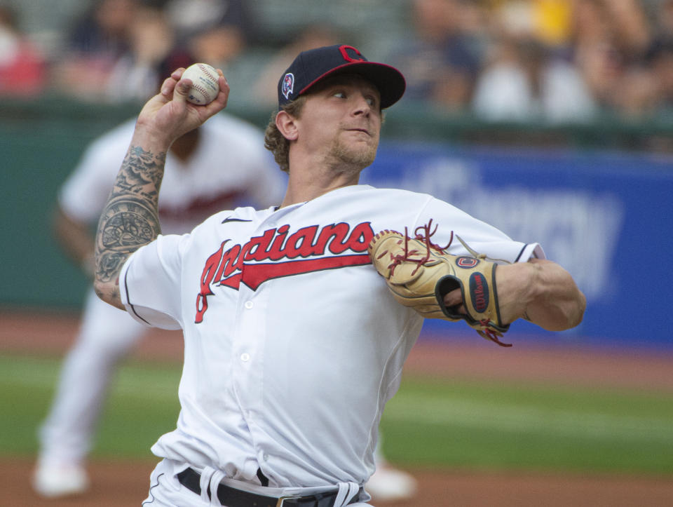 Cleveland Indians starting pitcher Zach Plesac delivers against the Milwaukee Brewers during the first inning of a baseball game in Cleveland, Saturday, Sept. 11, 2021. (AP Photo/Phil Long)