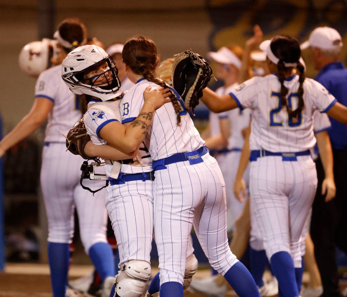 Boswell pitcher Karah Cardinal (8) and catcher Kaylee Sallee (2) celebrate their win during a high school softball game at Boswell High School in Saginaw, Texas, April 16, 2024. Boswell defeated Trinity 6-0 which left the two teams tied for first place. (Special to the Star-Telegram/Bob Booth)