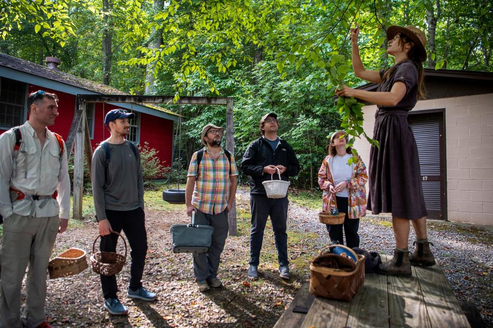 Kat Shaw, a guide with No Taste Like Home, talks about the edible uses of the birch tree while on a foraging tour in Black Mountain.