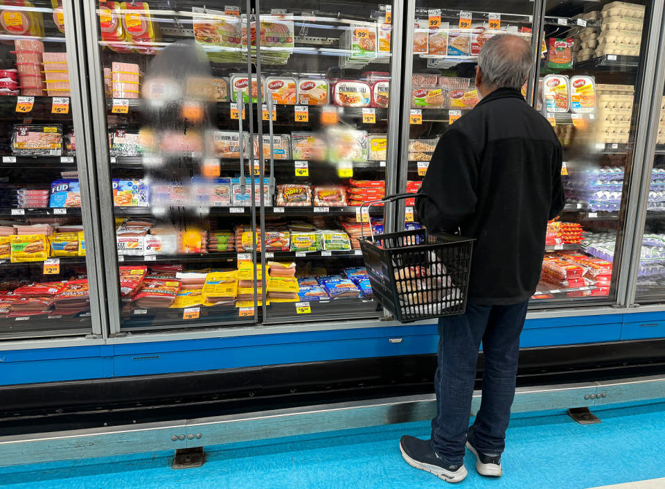 Customer looks at deli meat section at grocery store.  (Justin Sullivan / Getty Images)