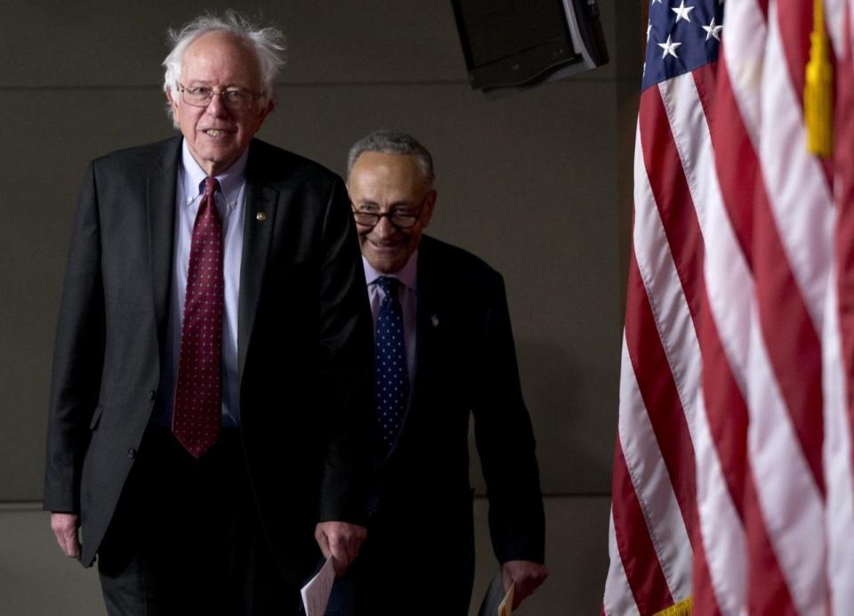 Sen. Bernie Sanders, I-Vt., left, followed by Sen. Charles Schumer, D-N.Y., arrives for a news conference on Capitol Hill in Washington, Wednesday, April 29, 2015. (AP Photo/Carolyn Kaster)