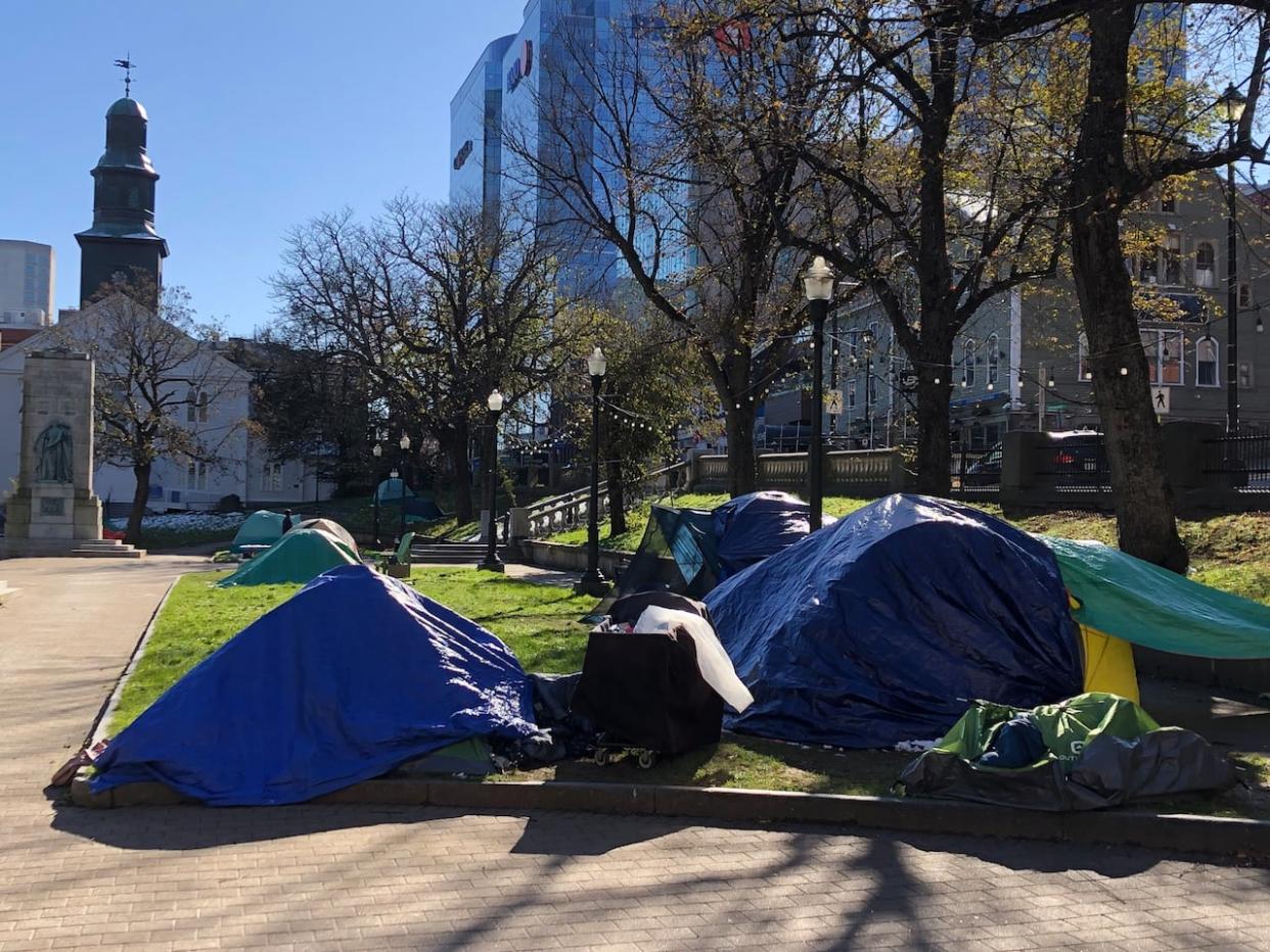 A growing number of people have been sheltering in tents in Grand Parade in downtown Halifax and throughout the municipality.  (CBC / Radio-Canada - image credit)