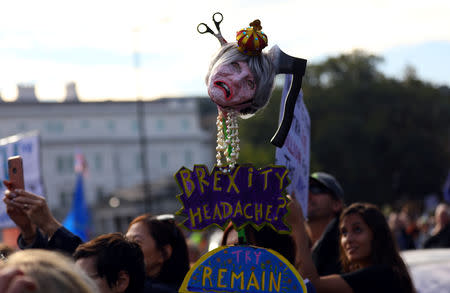 Protesters participating in an anti-Brexit demonstration, carry an effigy of Britain's Prime Minister Theresa May, as they march through central London, Britain October 20, 2018. REUTERS/Simon Dawson