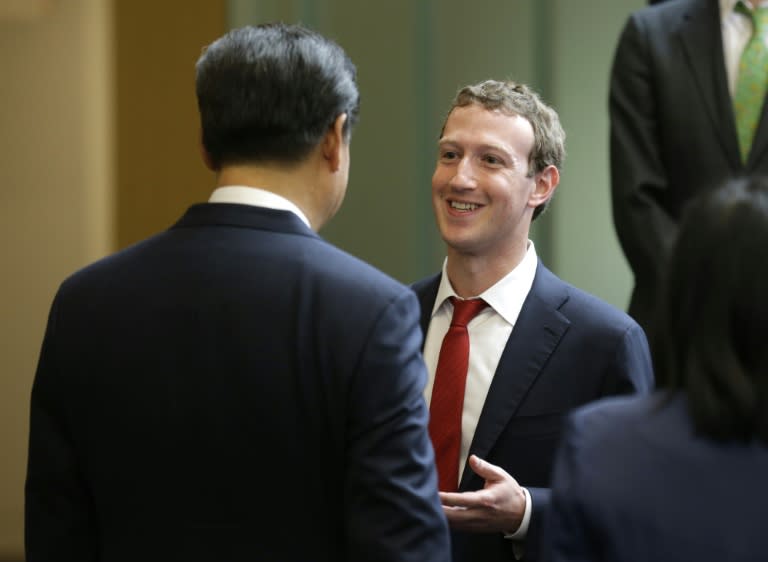 Chinese President Xi Jinping, left, talks with Facebook Chief Executive Mark Zuckerberg, right, during a gathering of CEOs and other executives at Microsoft's main campus in Redmond, Washington, on September 23, 2015