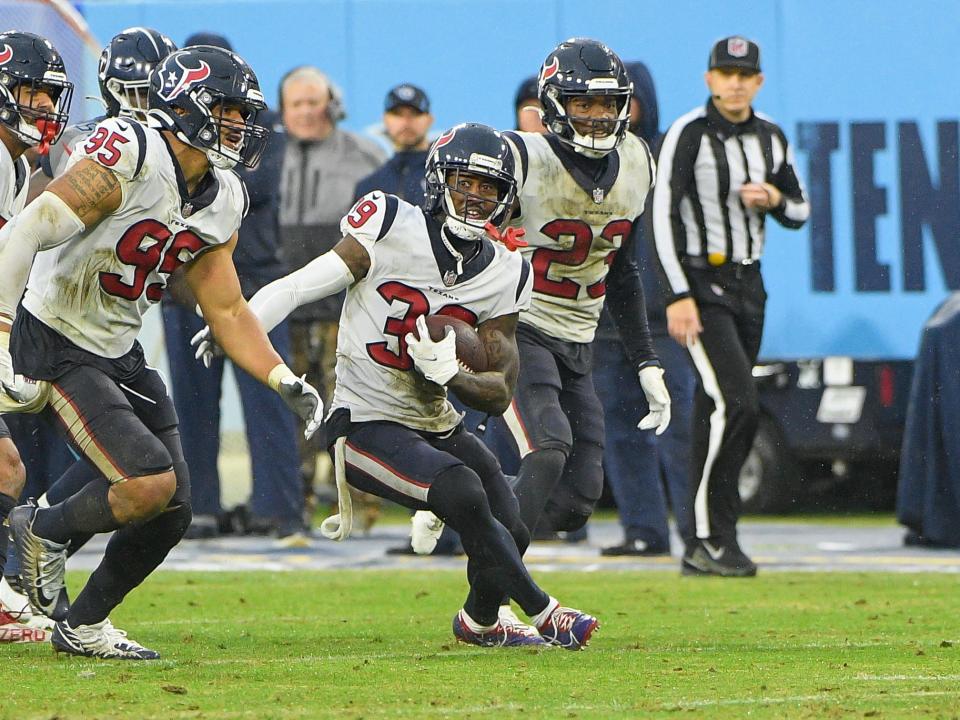 Houston Texans cornerback Terrance Mitchell runs with the ball after intercepting a pass by Titans quarterback Ryan Tannehill during their game on Nov. 21 in Nashville.