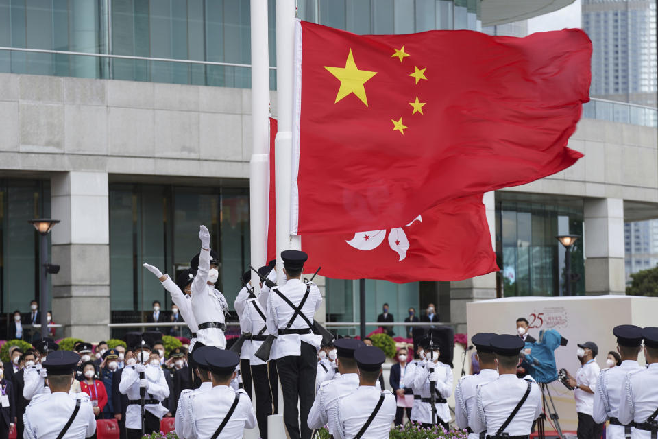 A flag raising ceremony is held at the Golden Bauhinia Square to mark the 25th anniversary of the former British colony's return to Chinese rule, in Hong Kong, Friday, July 1, 2022. (AP Photo/Magnum Chan, Pool)