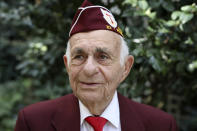 Harold Radish, 95, of the 90th division and a prisoner of war, poses during an interview with the Associated Press Friday, Aug.23, 2019 in Paris. Radish arrived in Normandy a few months after D-Day, fought into Germany, and then was captured and held as a prisoner of war. As a Jew, he remains surprised and grateful to have made it out alive. Radish was part of a group of World War II veterans taking part in commemorations of the 75th anniversary of the Allied operation to liberate Paris from Nazi occupation. (AP Photo/Daniel Cole)